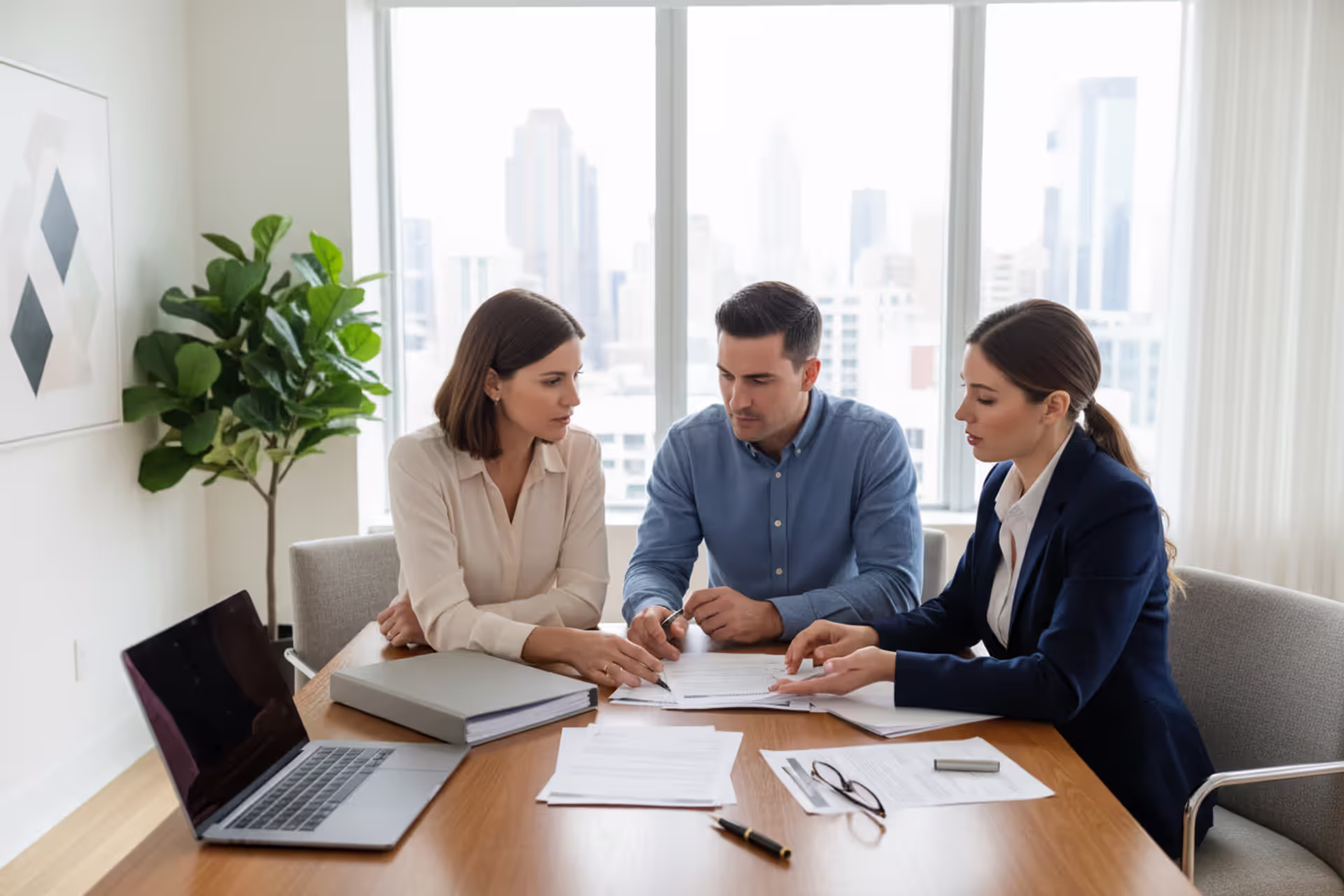Couple reviewing estate planning documents with an attorney